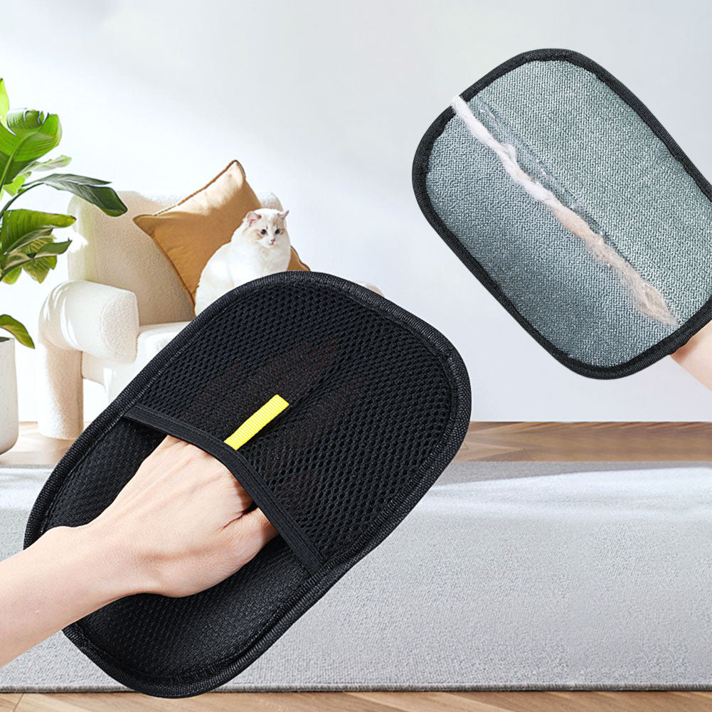 Black pet hair remover mitt collecting hair from upholstery