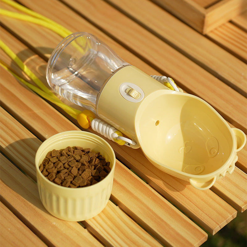 Portable dog water bottle beside a separate food compartment